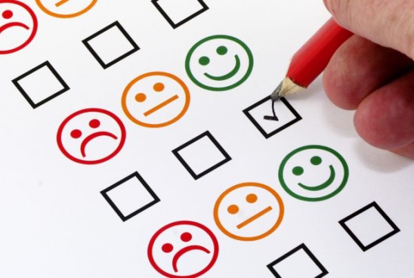Person ticking box to show positive survey response